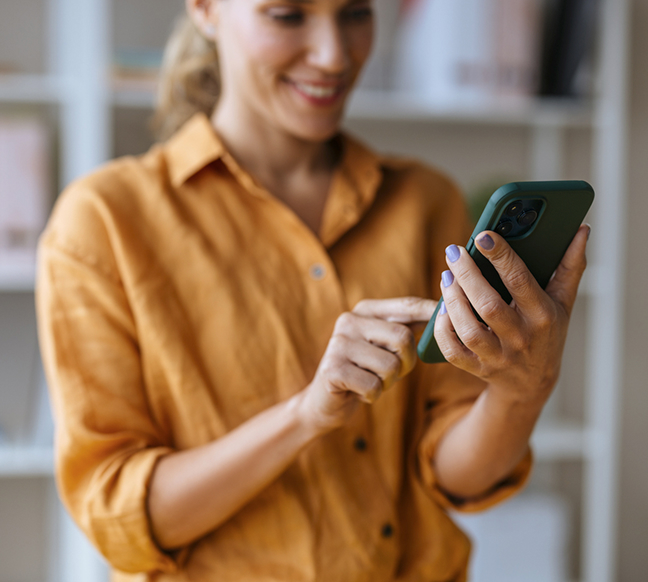 Person browsing Clarventa job openings on a phone.